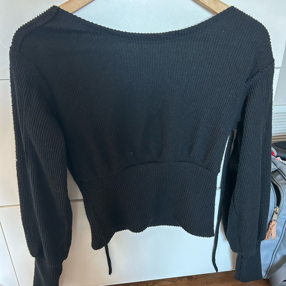 Black Anthropologie cropped tie sweater.